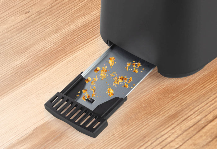 Praktický dizajn so zásobníkom na omrvinky.